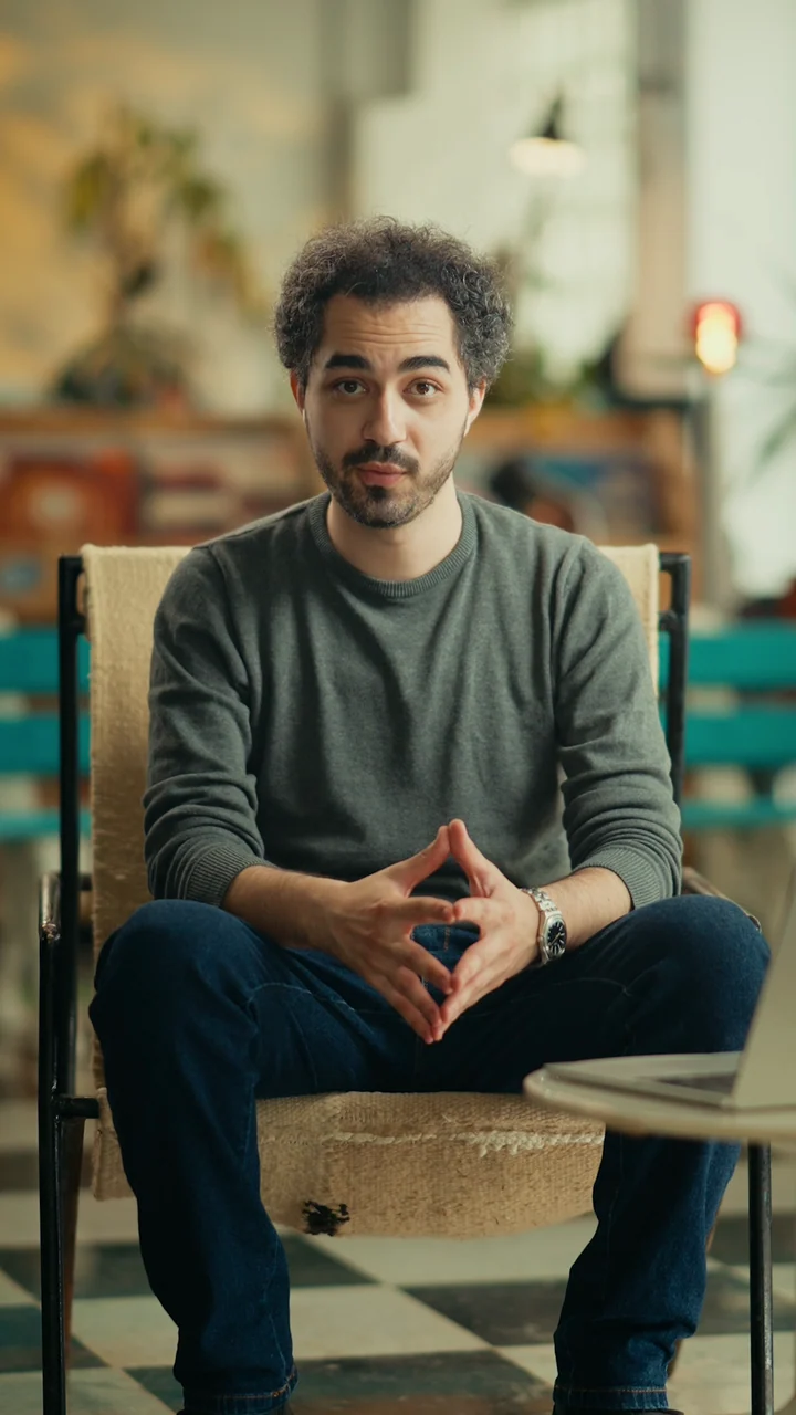 Baha Lajmi, founder of VALORA Productions, seated in a home interior